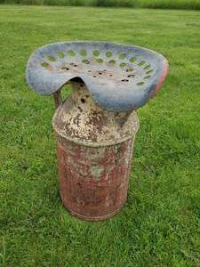 lot 42 image: Vintage Milk can With Vintage Tractor seat