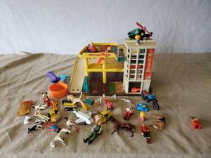 lot 96 image: Vintage Toy Lot, Fisher Price Garage, Wooden Toy Lot, And other Figurines