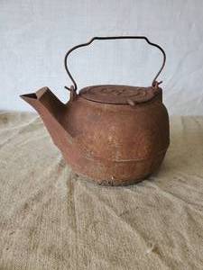 lot 112 image: Large Unique Cast Iron Pot wih Spout  Notice the hole in the bottom Still a great Display Item
