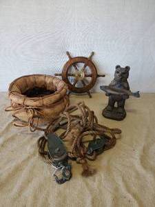 lot 130 image: Lot of Nautical Lake Dcor, Pully with Rope Small Sips Wheel, Bear Holding Fish and Antique Basket