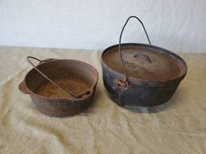 lot 137 image: Large #12 Cast IronTri Foot  Cauldron with Lid ,and Griswold Cast Iron Pot