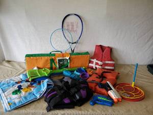 lot 80 image: Kids Lot of Life Vests, Volleyball Set, Giant Bubble making Items and more with Tub