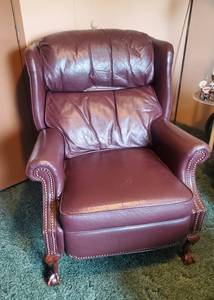 lot 155 image: Gorgeous Vintage Barcalounger Reclining Chair. Notice the Wooden Carved Claw Foot Legs and Awesome Classy Studded Seams and Beautiful Red Leather.  This is a gorgeous Chair that Sells for over $1500