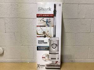 lot 87 image: Shark Upright Vacuum, Navigator Lift-Away Deluxe with Large Dust Cup Capacity, HEPA Filter, Swivel Steering, Upholstery Tool & Crevice Tool