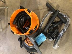 lot 55 image: RIDGID 16 Gallon 6.5 Peak HP NXT Shop Vacuum Wet Dry Vac with Cart, Fine Dust Filter, Locking Hose and Accessory Attachments Customer Returns See Pictures