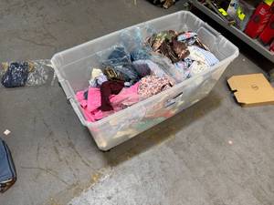 lot 228 image: Bin of shirts, pants, belts, socks