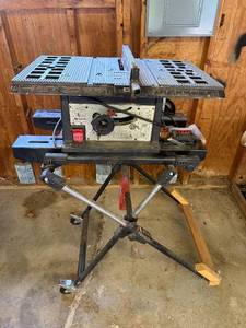 lot 4 image: Rockwell Model 8 Motorized Saw on Craftsman Stand