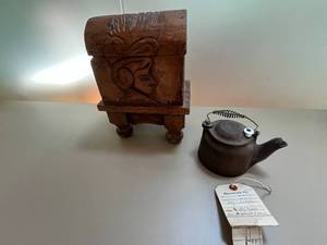 lot 64 image: Vintage Carved Wooden Chest and Iron Teapot Set