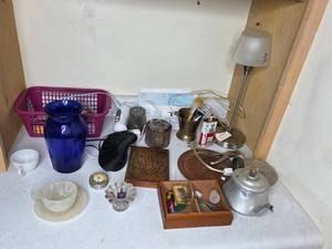 lot 109 image: Mixed Household Items Including Decor, Tools, and Batteries