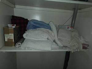 lot 128 image: Assorted Collection of Bathroom Towels, Toiletries, and First Aid Supplies