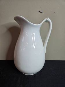 lot 270 image: Elegant White Porcelain Pitcher with Curved Handle