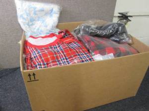 lot 204 image: Box of assorted shirts and pants...