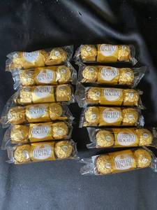 lot 83 image: B5 - Collection of 12 Ferrero Rocher Chocolate Packs