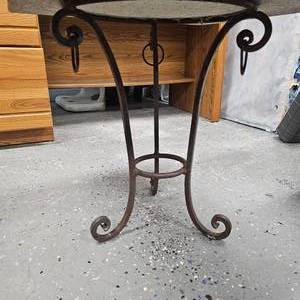 lot 5 image: Granite Slab Patio Table 23x23. Wrought Iron Style Frame