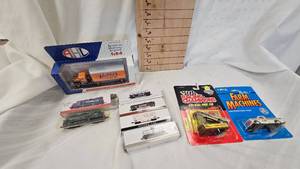 lot 28 image: Ertl Farmer Die Cast, Racing Champion Die Cast, 164 Yellow Transit Semi in Box,