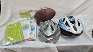 lot 164 image: Bike Helmets, Football, and air Mattresses in packages