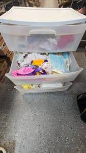 lot 143 image: 3 Drawer Cart filled with various baby clothes(most ranging from 9 Dolls to 18 Dolls