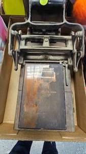 lot 139 image: Antique Iron Warmer, Cast Iron Printing Press along with Print Plate featuring  Grand Trunk Pacific Railway