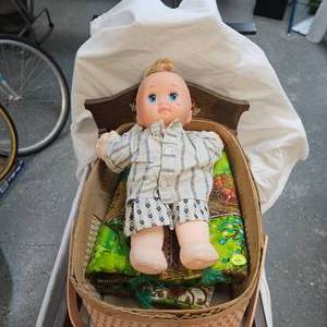lot 120 image: Wood Doll CradleBasket with Doll, Blankets, Doll Diapers and more
