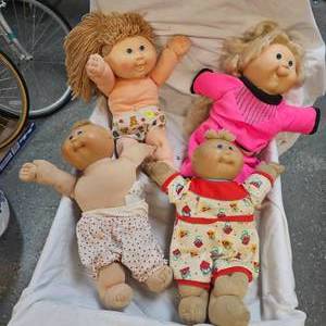 lot 124 image: Lot of 4 Cabbage Patch Dolls as shown in photos