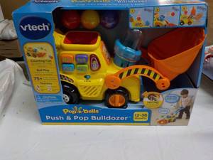 lot 3 image: Vtech Push and Pop Bulldozer...