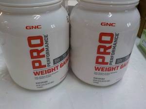 lot 222 image: 2 GNC Weight Gainer...