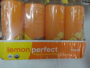 lot 243 image: 12 Pack Peach Organic Lemon Water...