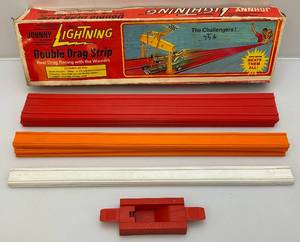 lot 72 image: 1960s JOHNNY Lightning Double Drag Strip In Original Box (NO CARS) Box Beat Up A Little