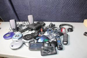 lot 46 image: Electronics Assortment CD Players, GPS Devices, Speakers, and More