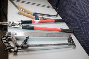 lot 73 image: Collection of Hand Tools Including Pruning Shears, Bow Saw, and Hacksaw