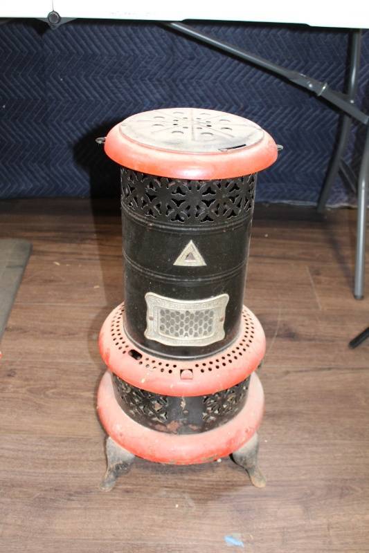 lot 65B image: Antique Kerosene Heater with Decorative Metal Exterior
