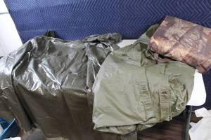 lot 36 image: Set of 2 Military Surplus Olive Green Rain Ponchos with Woodland Pattern seat cushion  life preserver.
