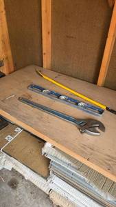 lot 1541 image: Set of 3 Hand Tools Adjustable Wrench, Level, and Crowbar