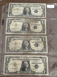 lot 31 image: 1957 Blue Seal $1 Dollar Silver Certificates