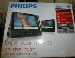 lot 23 image: 2 portable LCD screens for the kids to watch in the vehicle - used