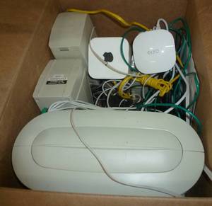 lot 42 image: Box of computer speakers and apple eero wifi extender