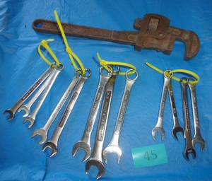 Lot of SAE wrenches and a pipe wrench