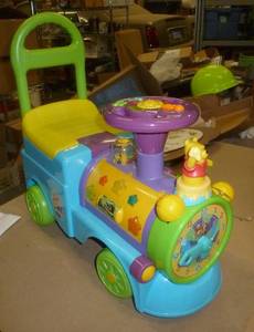 lot 108 image: Ride or push Winnie the Pooh activity Train