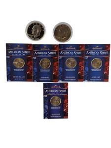 lot 48 image: Two Ike dollar coins, one of which is an uncirculated 1976 edition, as well as five uncirculated state quarters.