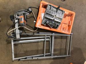lot 31 image: RIDGID 9-Amp 7 in. Blade Corded Wet Tile Saw with Stand used  Customer Returns See Pictures