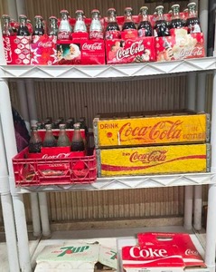 lot 141 image: Coca-Cola Collectibles Holiday limited edition bottles, old crates, cardboard cases and 4 holiday coasters