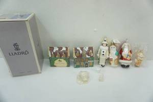 lot 52 image: Lladro Destination Big Top Figurine in Box-Valencia, Snow babies Miniatures Igloo, glass Christmas Ornaments, and 2ct Deadlock Arms 1994 Collectors Edition Ornaments by Department 56
