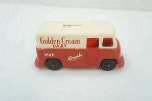 lot 80 image: Vintage Golden Cream Dairy Milk Truck Bank