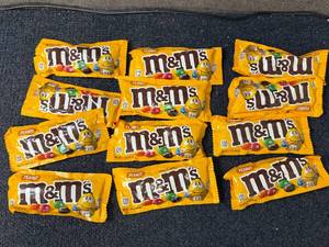 lot 213 image: 12 Bags of Peanut M&Ms