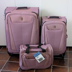 lot 378 image: Three Piece Lavender Travelpro Luggage Set
