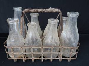 lot 32 image: SOLID METAL VINTAGE MILK CARRIER WITH BOTTLES