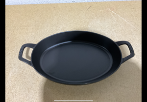 lot 84 image: Staub Cast Iron 12.5-Inch x 9-Inch Oval Baking Dish - Matte Black