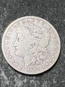 lot 31 image: 1889-O US MORGAN SILVER DOLLAR