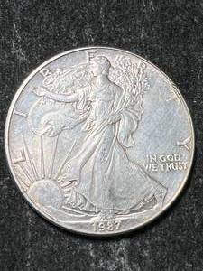 lot 45 image: 1987 AMERICAN SILVER EAGLE 1 TROY OZ .999 FINE SILVER