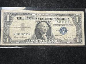 lot 75 image: 1957B US BLUE SEAL $1 SILVER CERTIFICATE
